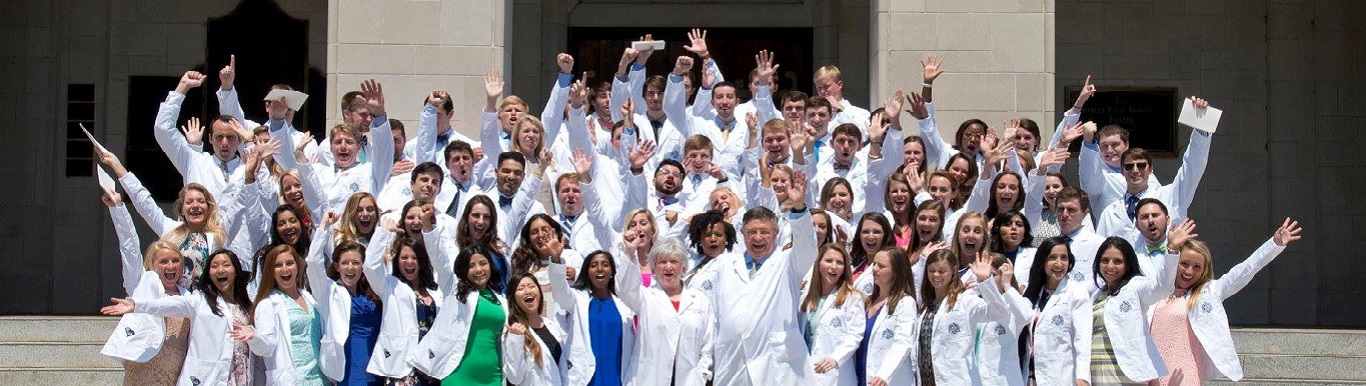 Students in their white coats