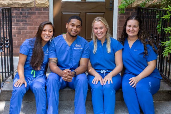 Smiling students of the James B. Edwards College of Dental Medicine.